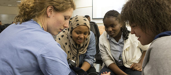 students watching blood pressure taken